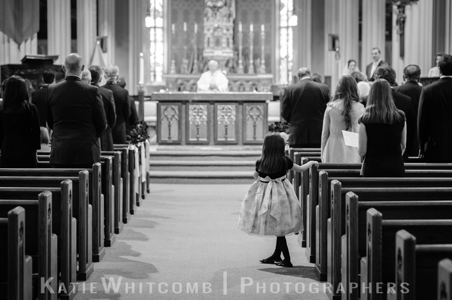 little girl watching communion ceremony at basilica at notre dame