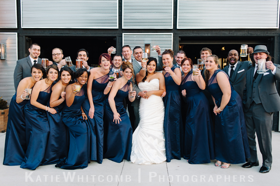 bridal party outside the brick in the cold on a beautiful december day