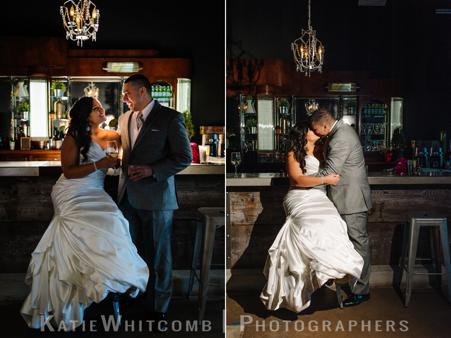 bride and groom sharing a moment at the bar at the brick during their wedding reception