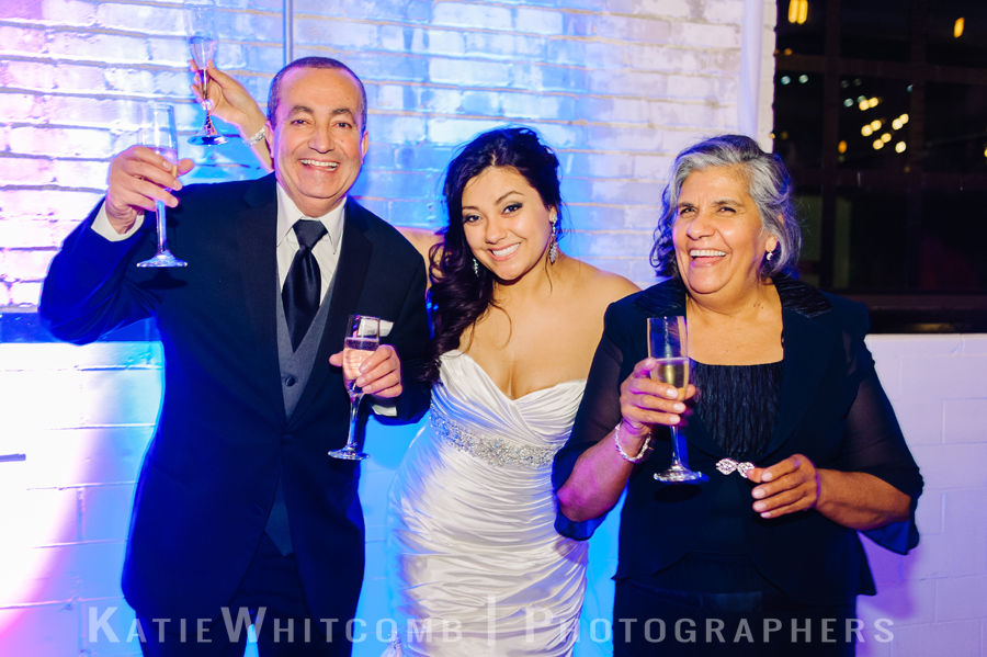 bride and her mother and groom's father at the wedding reception at the brick in south bend