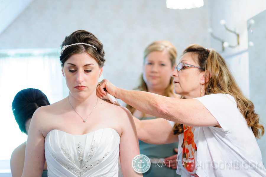 brides aunt putting her necklace on before the ceremony at grace united methodist church