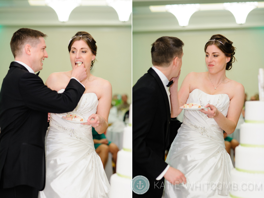 bride and groom eat cake at their reception at doubletree by hilton