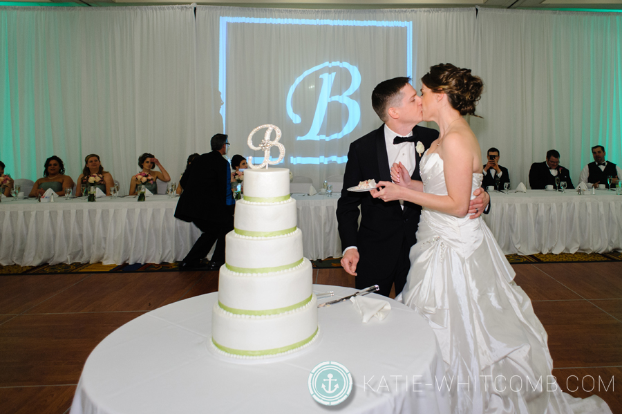 bride and groom kiss at their reception at doubletree by hilton