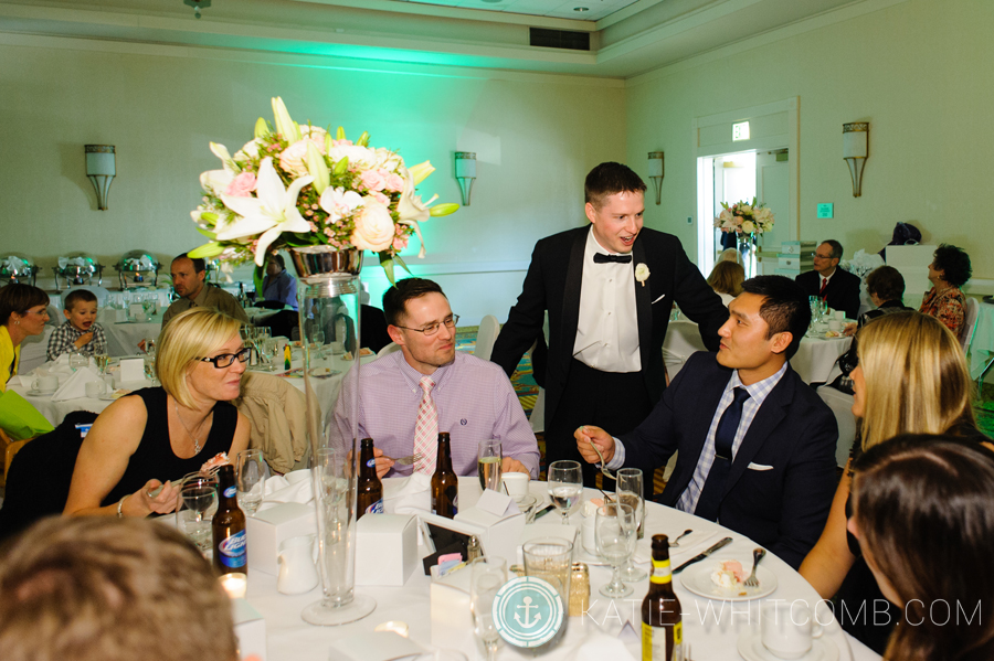 groom greets his guests at his reception at doubletree by hilton