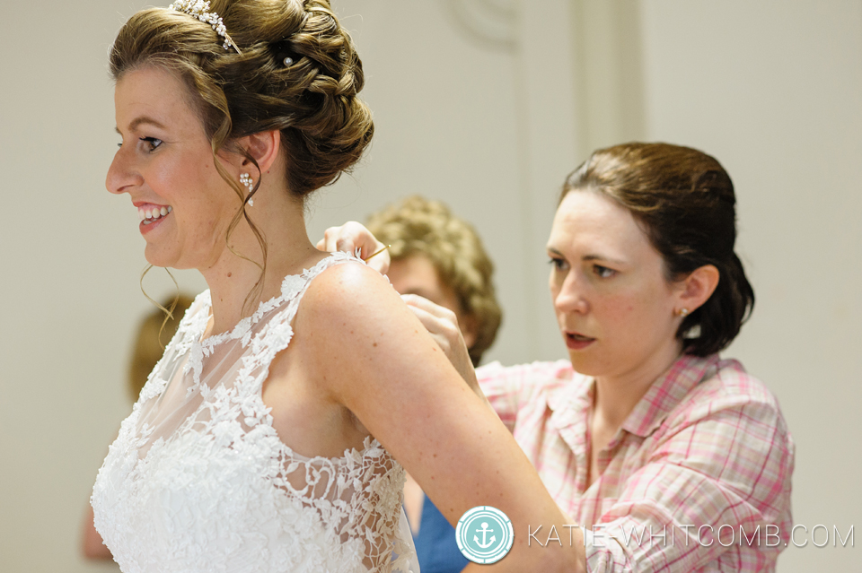 bride getting in her dress at st, mary's wedding