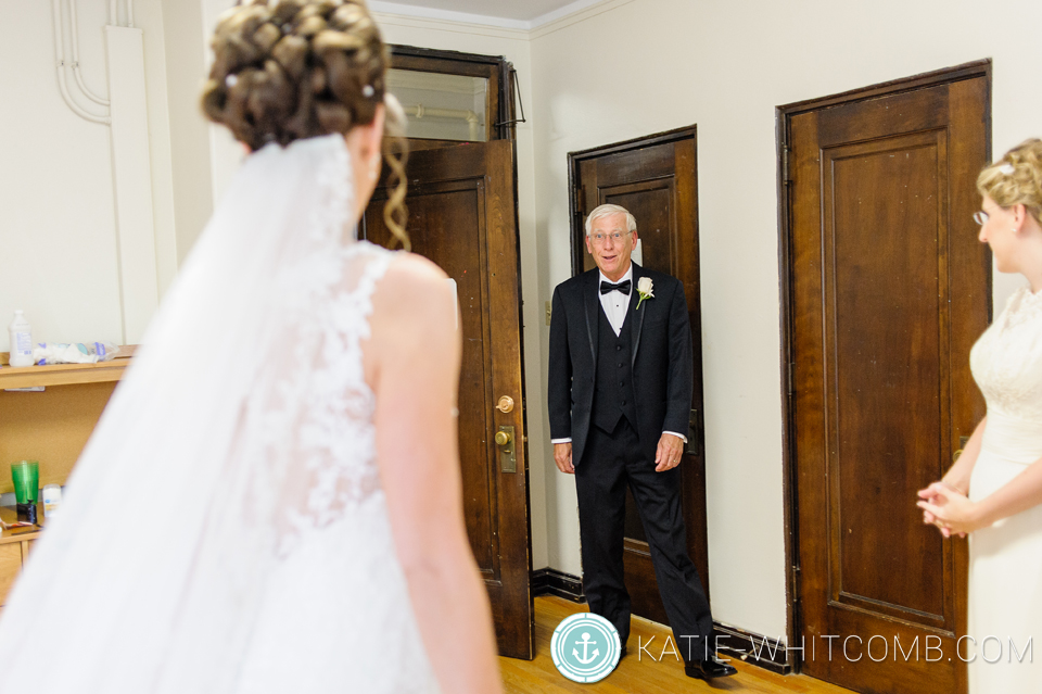 dad's first look at the bride before the wedding ceremony at st. mary's