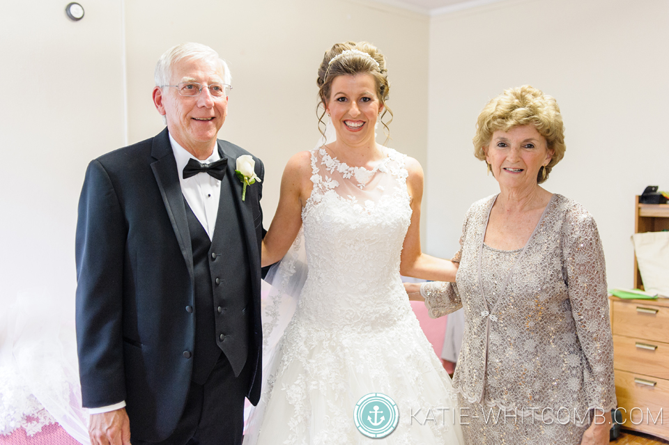 bride and her parents before the ceremony at st. mary's