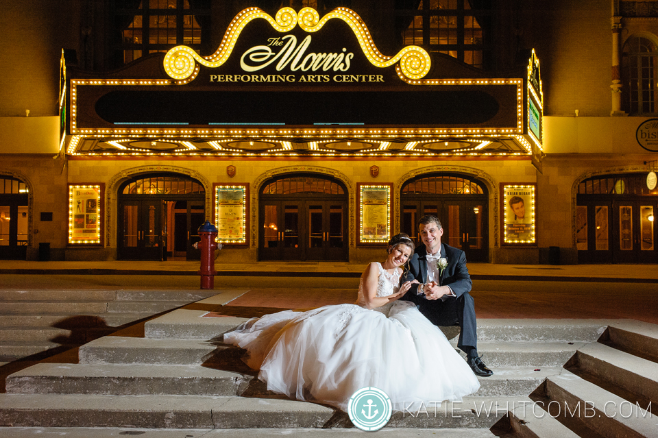 end of the night portrait of bride & groom outside morris civic theatre