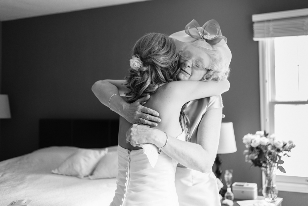 black and white bride and mom hugging emotions love irish