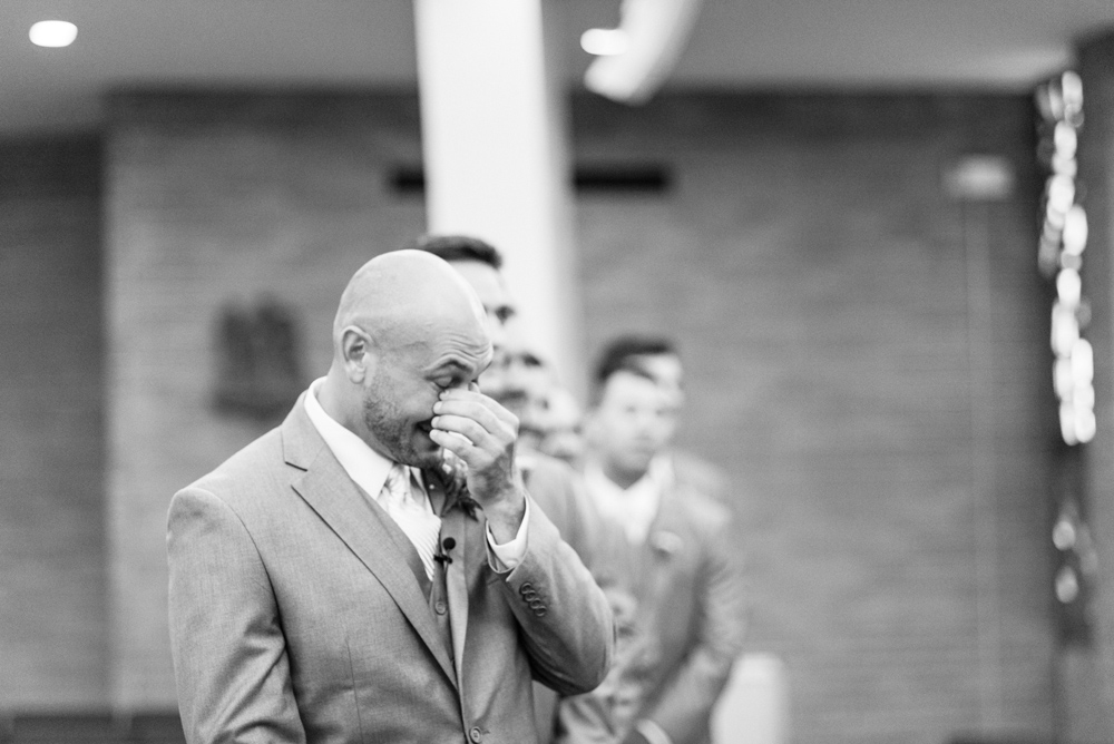 wedding ceremony groom crying black and white