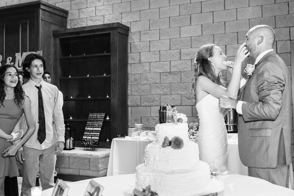 wedding reception black and white cake cutting