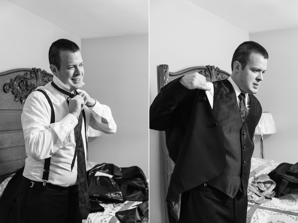 black and white groom getting dressed