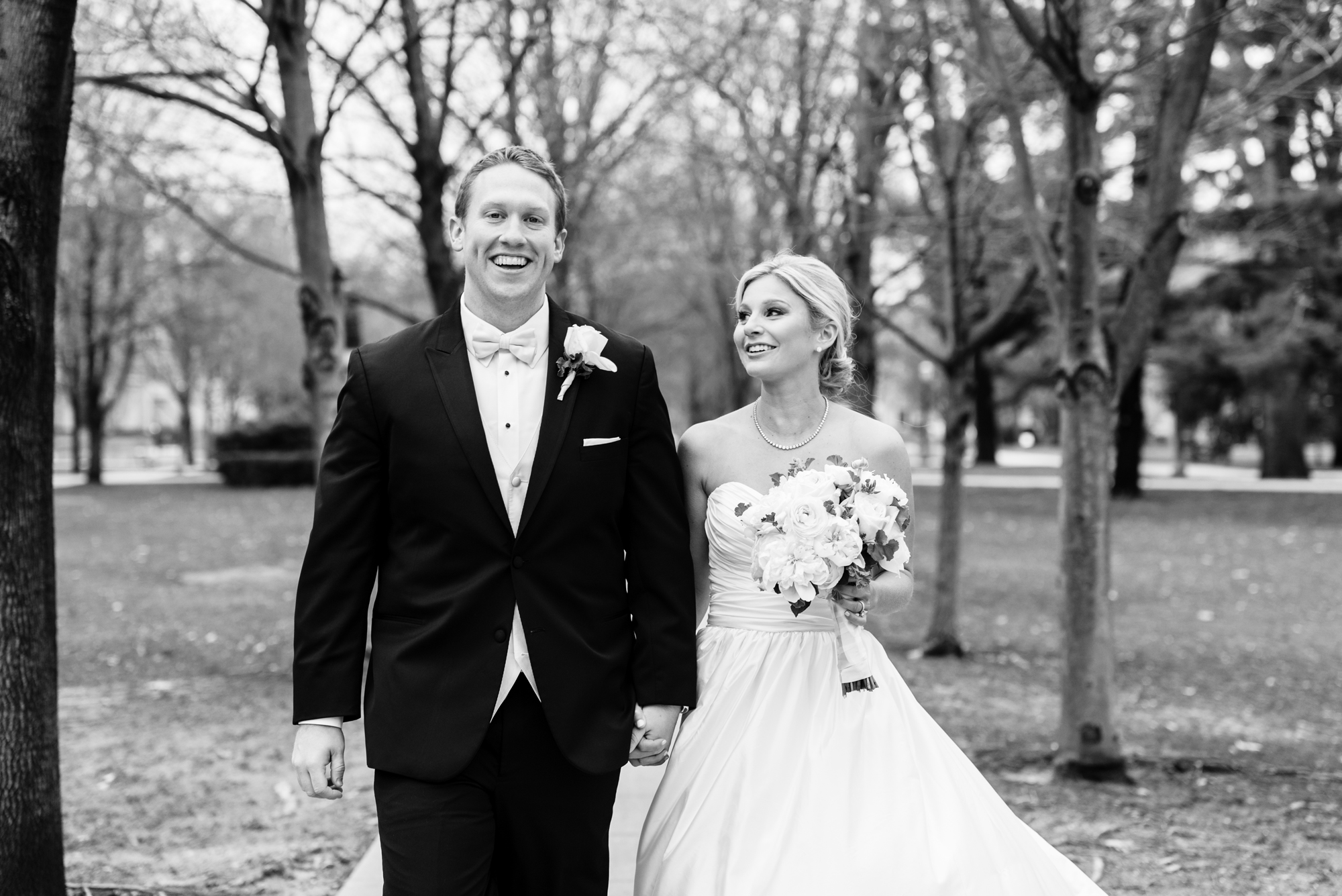 Bride & Groom walking on God Quad on the campus of University of Notre Dame