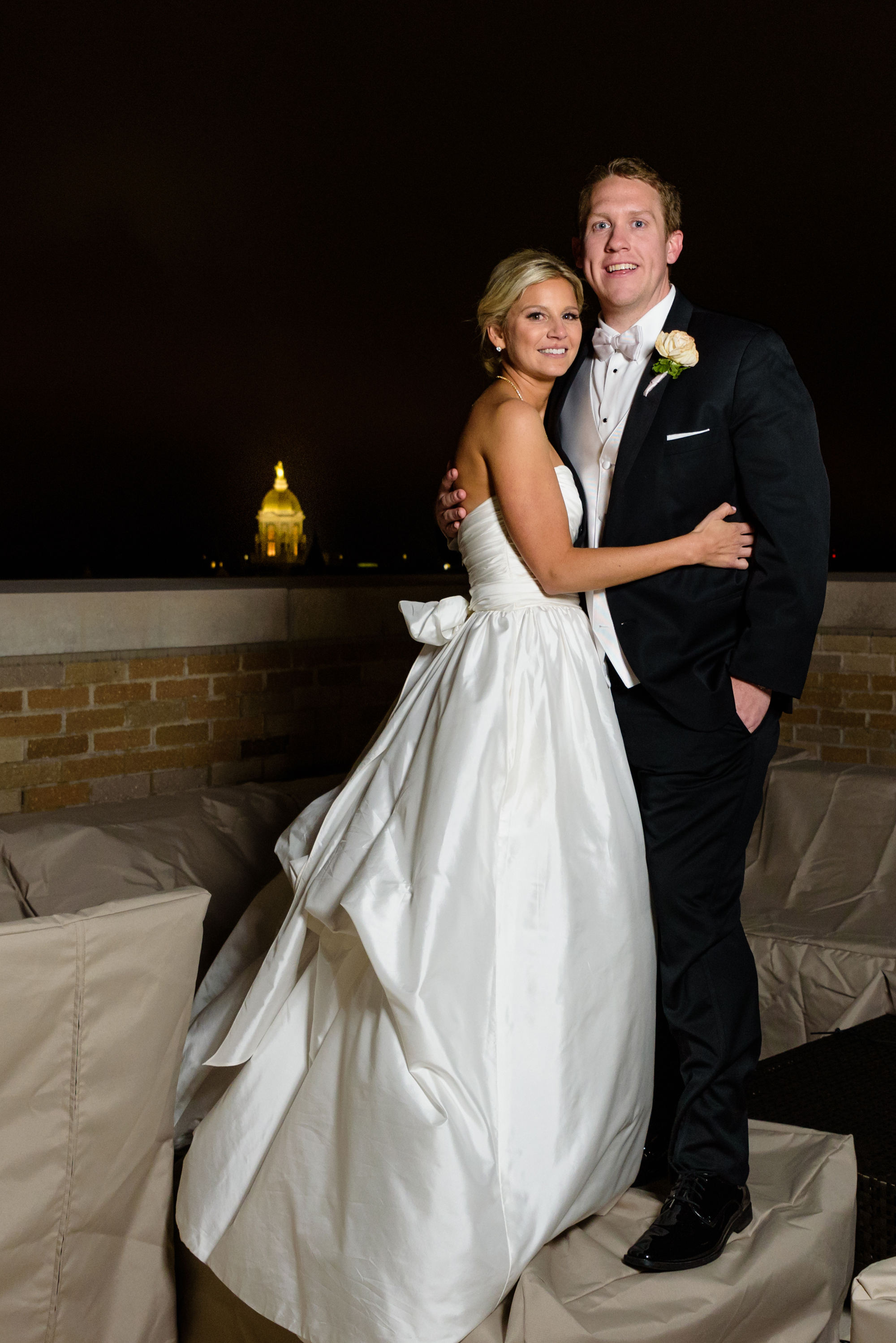 Golden Dome shot at night with the Bride & Groom outside the landings at Dahnke Ballroom on the campus of University of Notre Dame