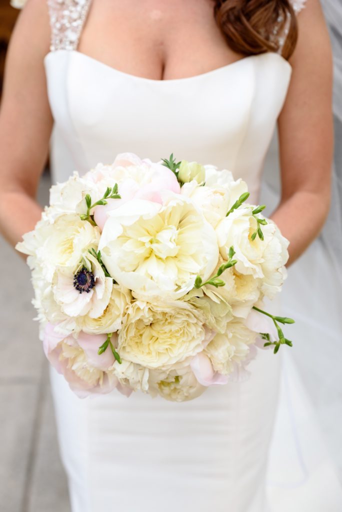 Bridal bouquet by Merry Me Events with anemones & peonies