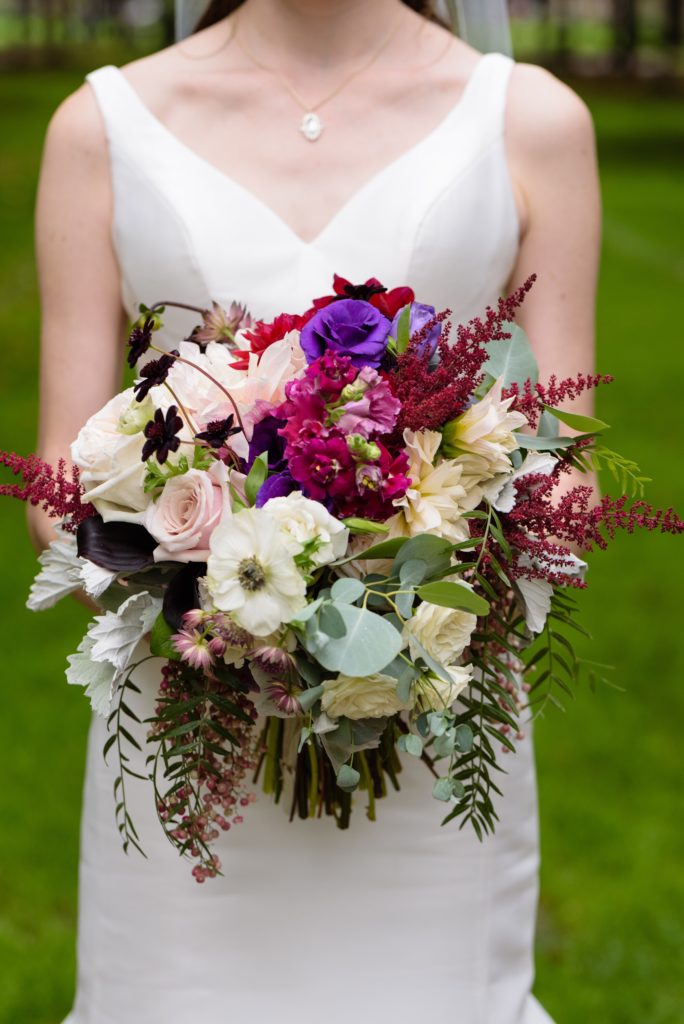 Bridal bouquet by Country Florist with eucalyptus, dahlias, roses & tulips