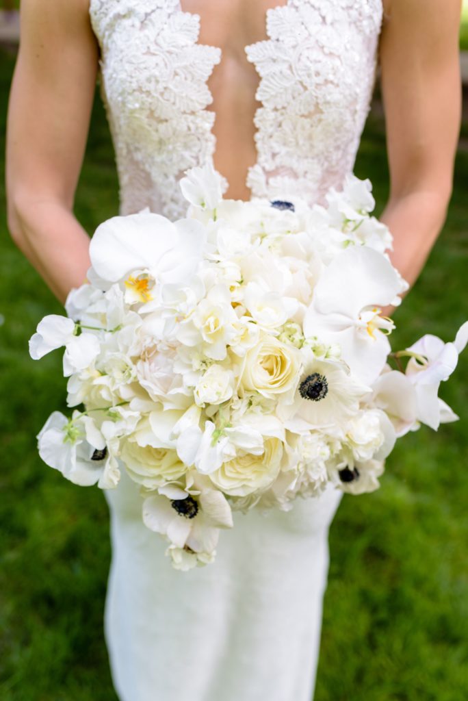 Bridal bouquet by MichaelAngelos Events with orchids, roses & anemones 