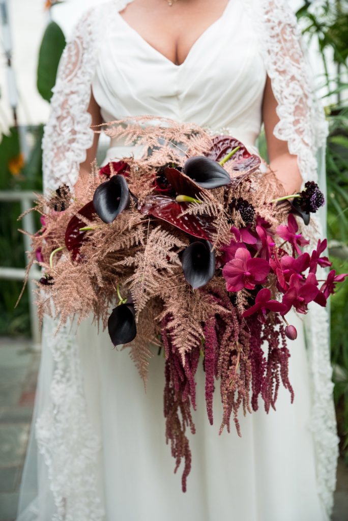 Bridal bouquet by MichaelAngelos Events with purple tulips, purple orchids & rose gold ferns