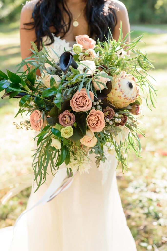 Bridal bouquet by Merry Me Events with roses, protea, tulips & anemones 