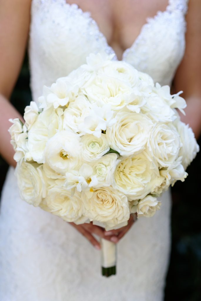 Bridal bouquet by Poppies by Polly with roses, ranunculus, & peonies 