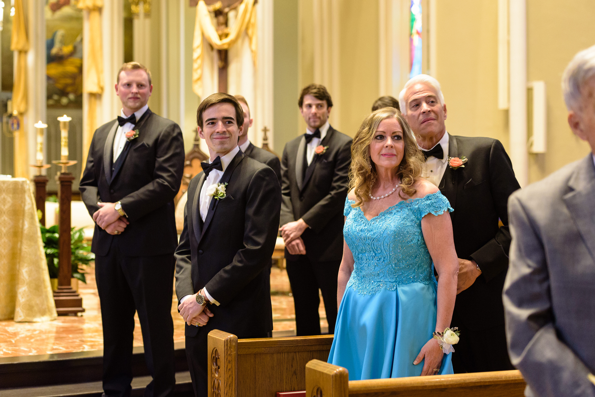 Groom seeing his bride for the first time as she enters the ceremony at the Basilica