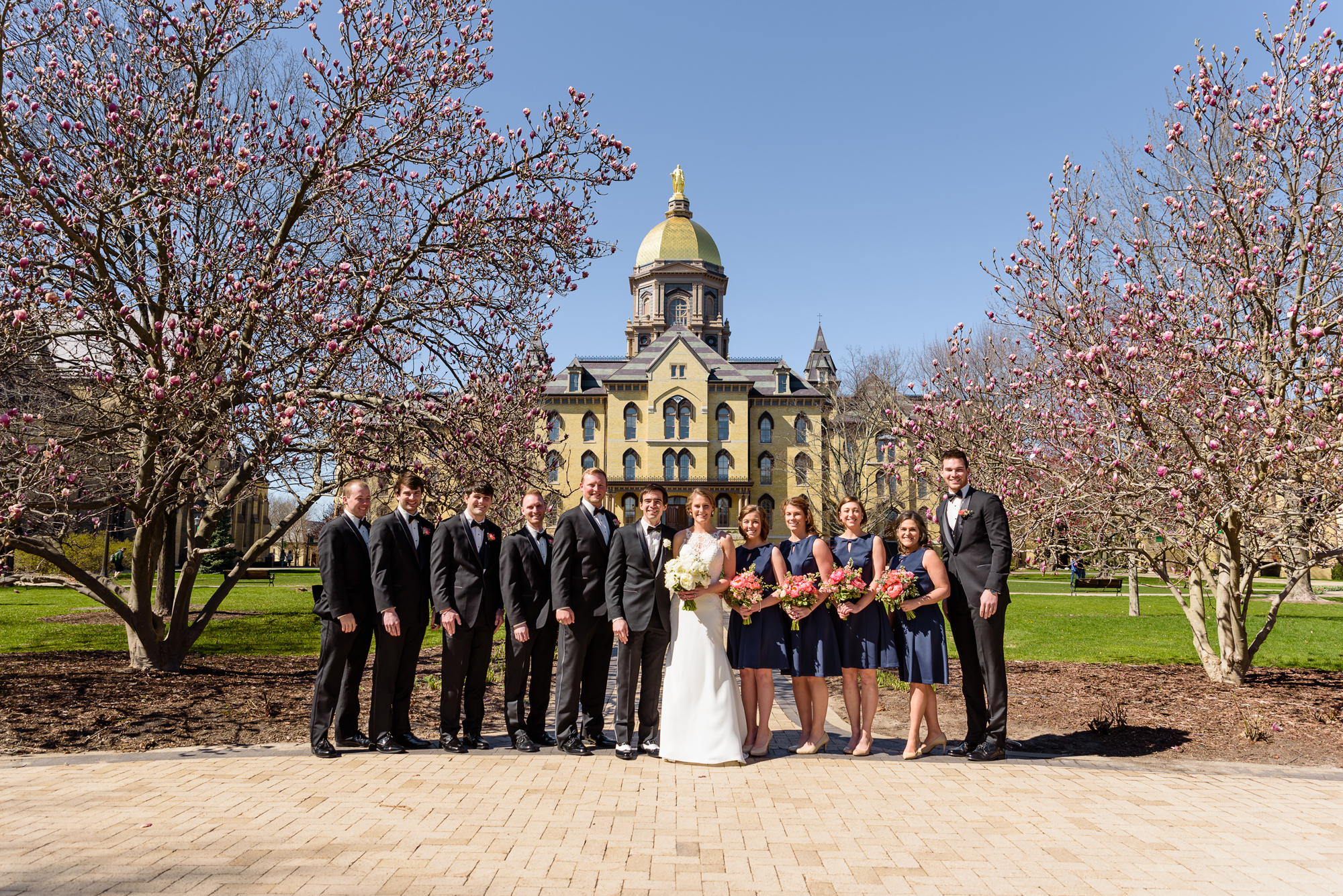 Bridal party with the Magnolia tree in front of the Golden Dome on the campus of Notre Dame