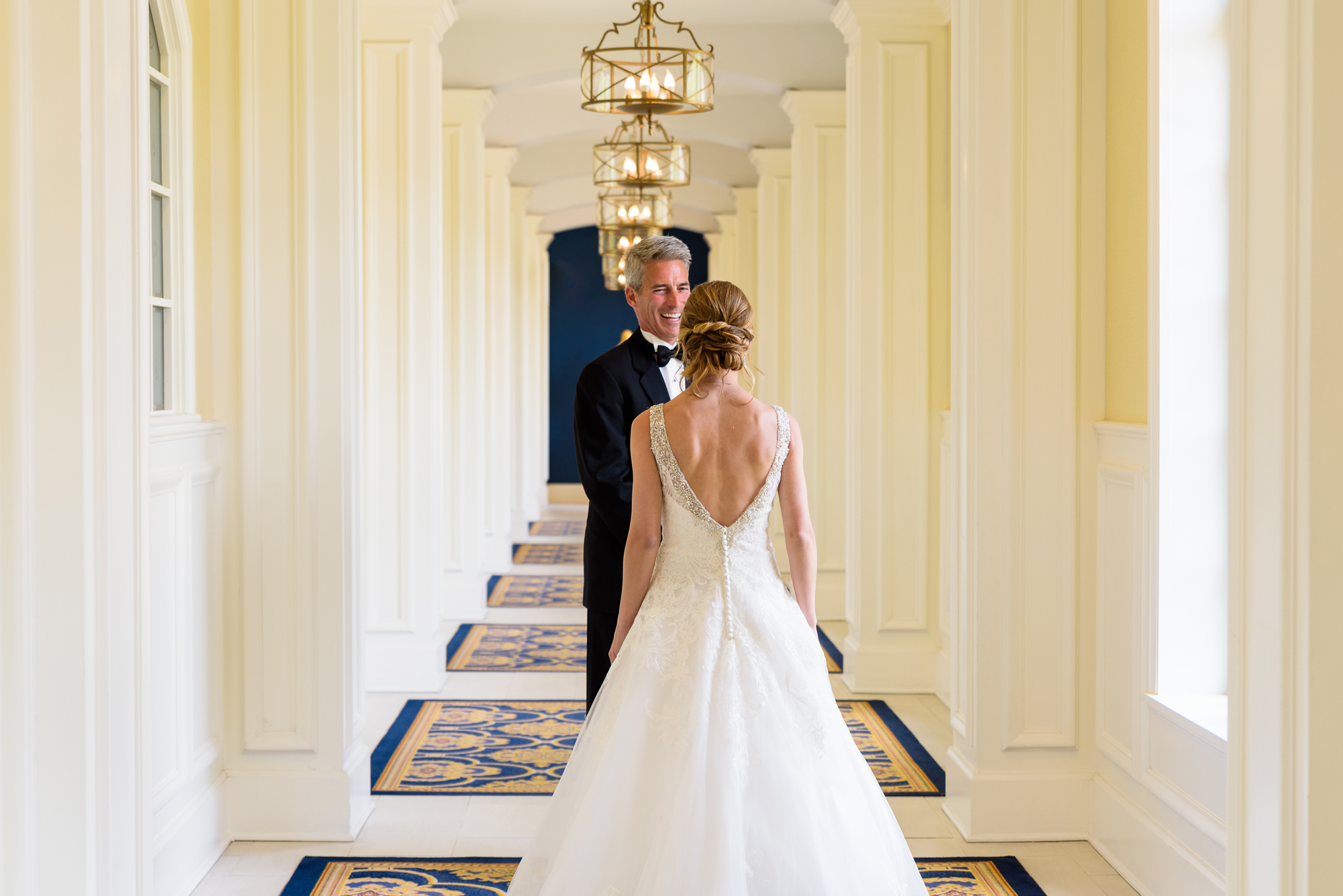 Father of the Bride seeing his daughter for the first time after she gets dressed for her wedding at the Basilica of the Sacred Heart on the campus of Notre Dame