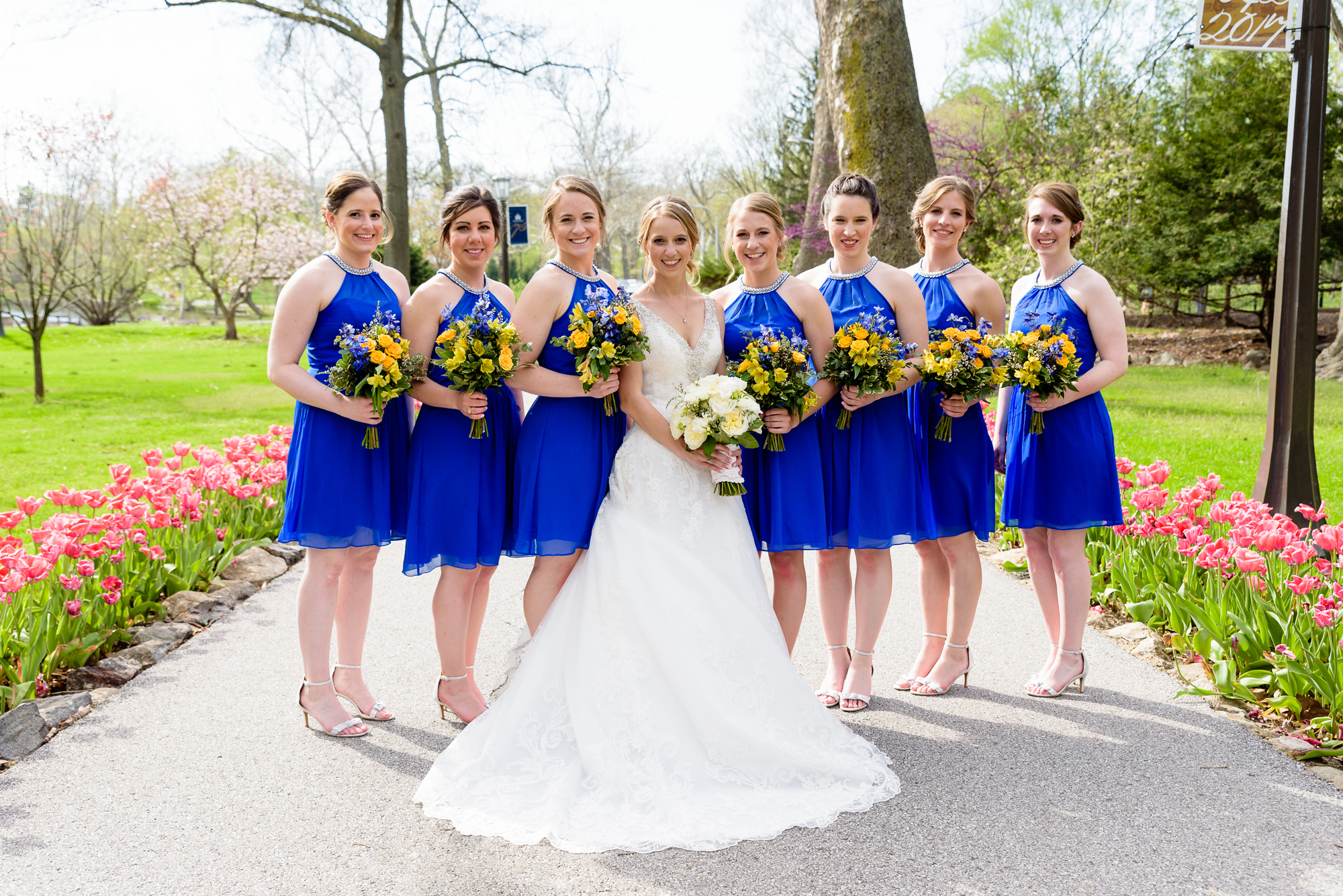 Bridesmaids by the tulips at the Grotto on the campus of Notre Dame