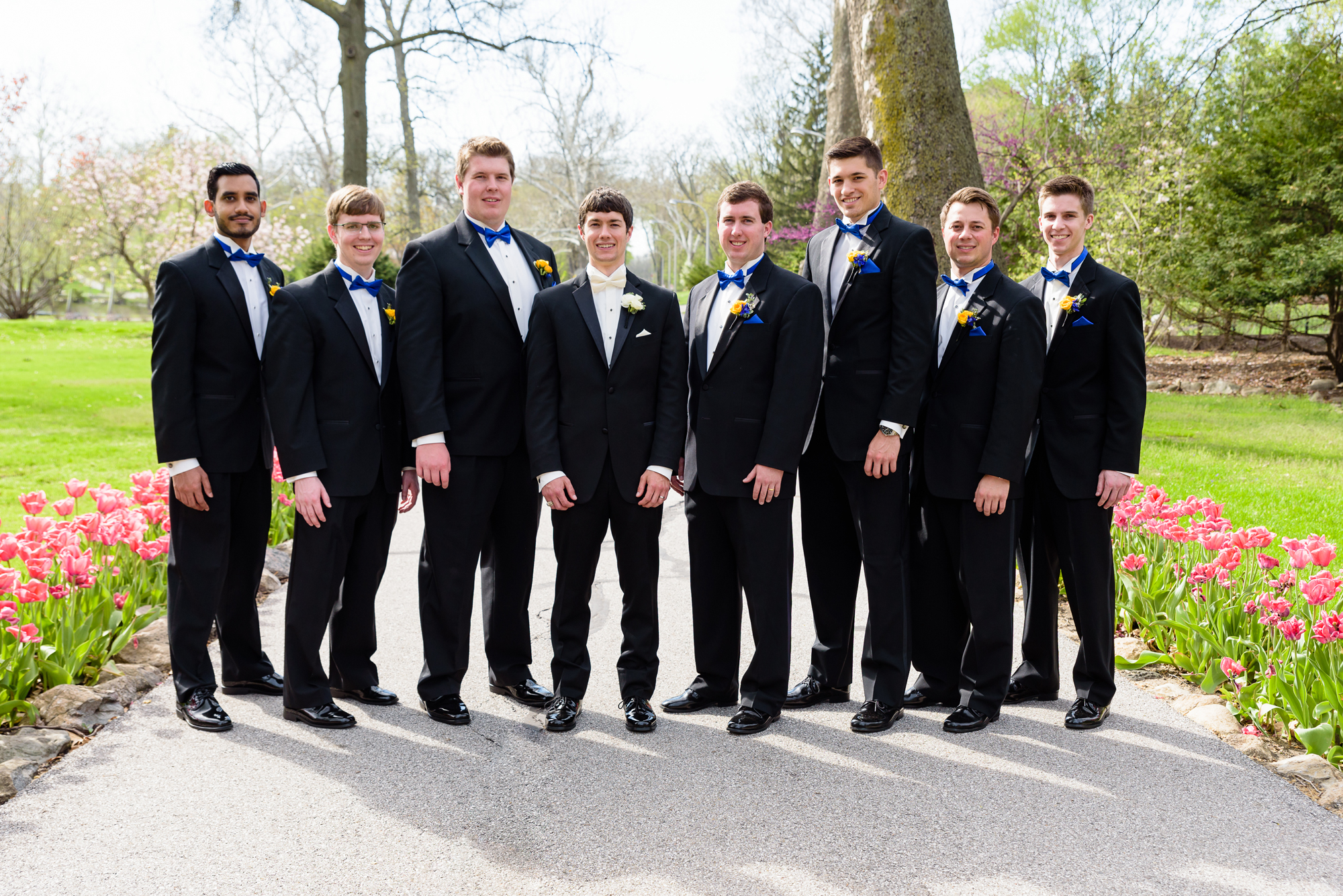 Groomsmen by the tulips at the Grotto on the campus of Notre Dame