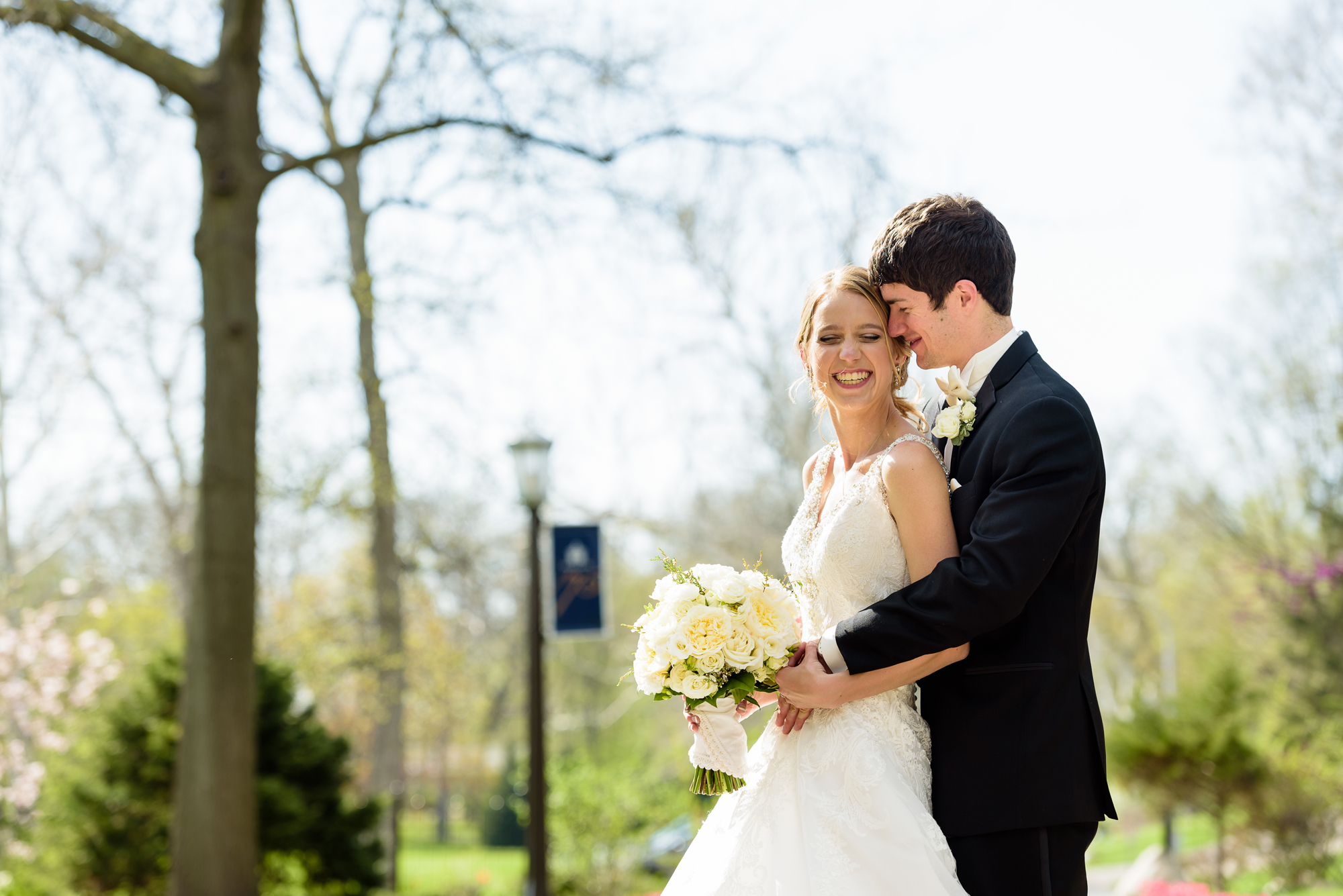 Bride & Groom by the tulips at the Grotto on the campus of Notre Dame