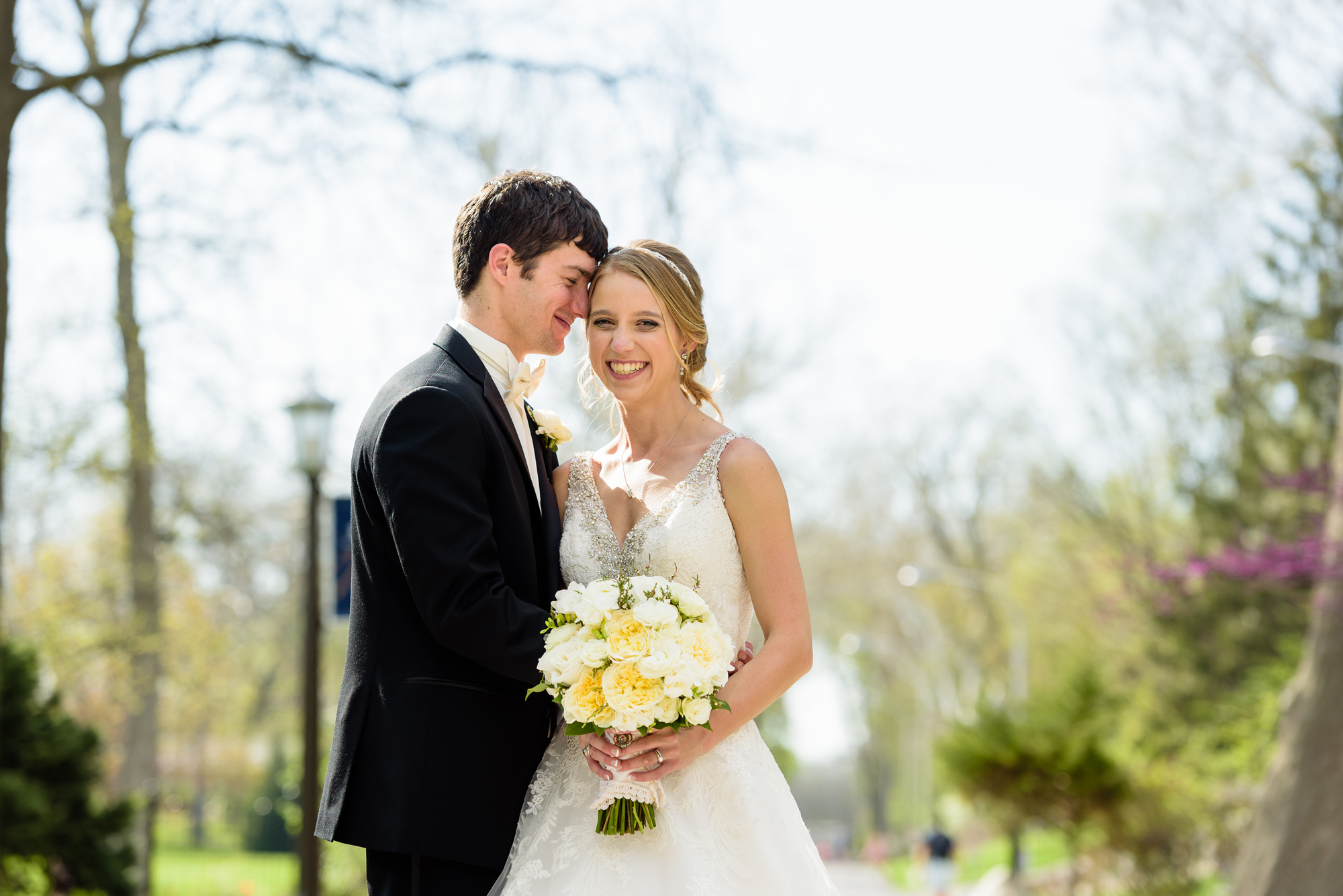 Bride & Groom by the tulips at the Grotto on the campus of Notre Dame