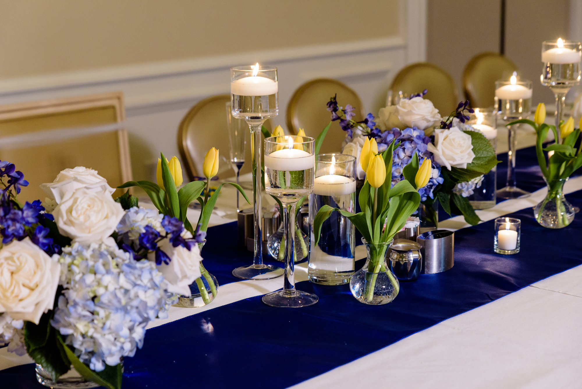 Centerpieces for a wedding reception at the Morris Inn on the campus of Notre Dame by Poppies by Polly