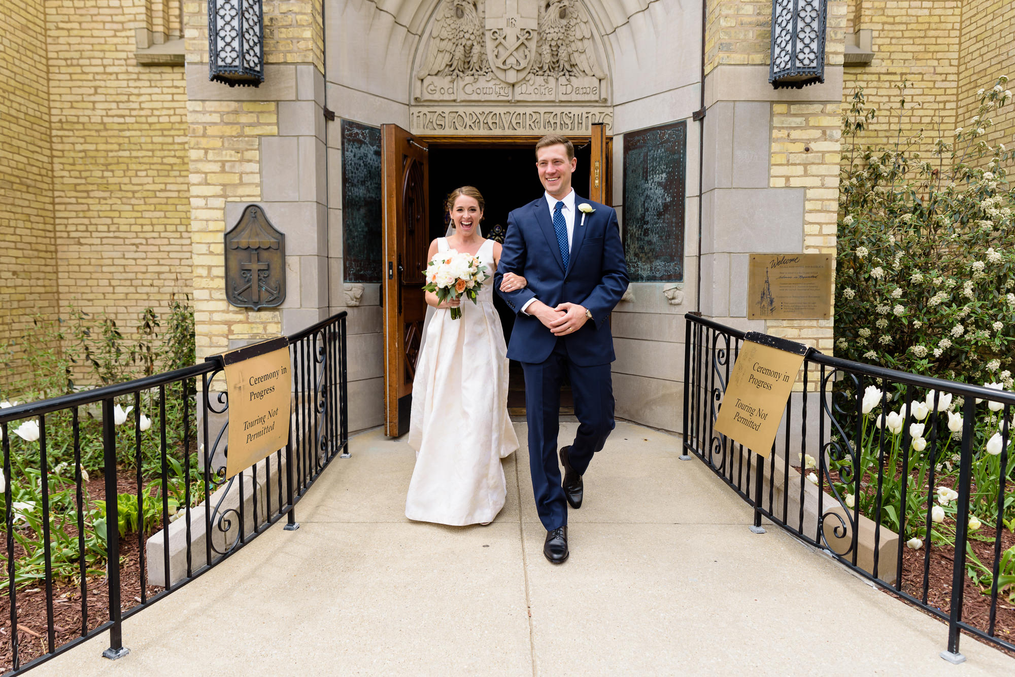 Bride & Groom leaving their wedding ceremony from God Country Door at the Basilica of the Sacred Heart at the University of Notre Dame