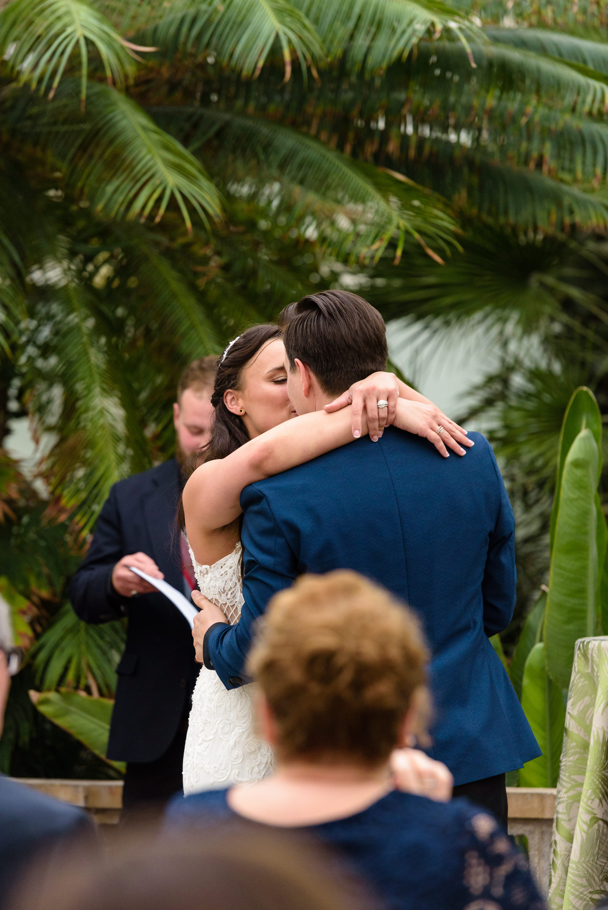 first kiss at a wedding ceremony at Potawatomi Conservatory