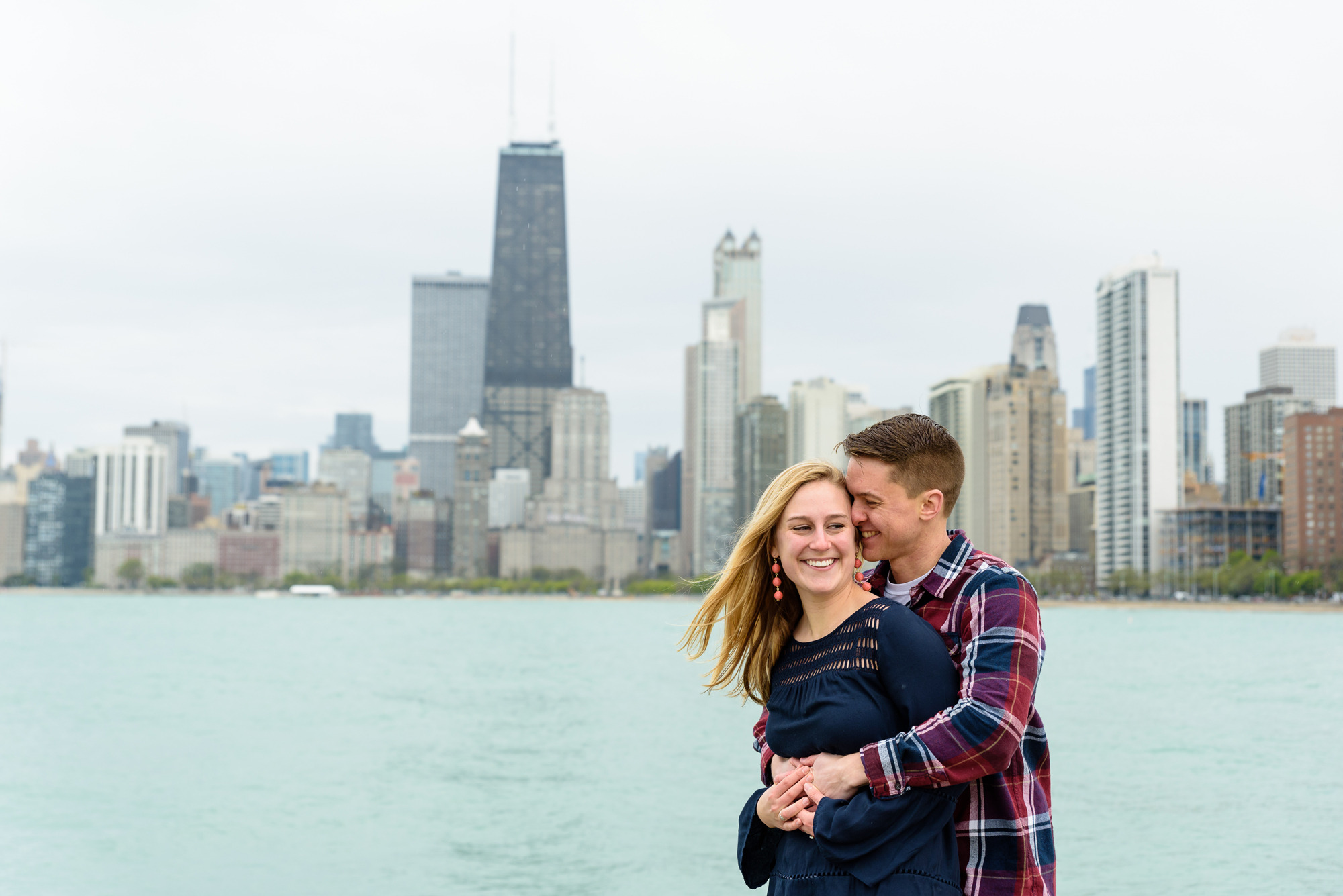 Engagement session at North Ave Beach Pier with the Chicago skyline