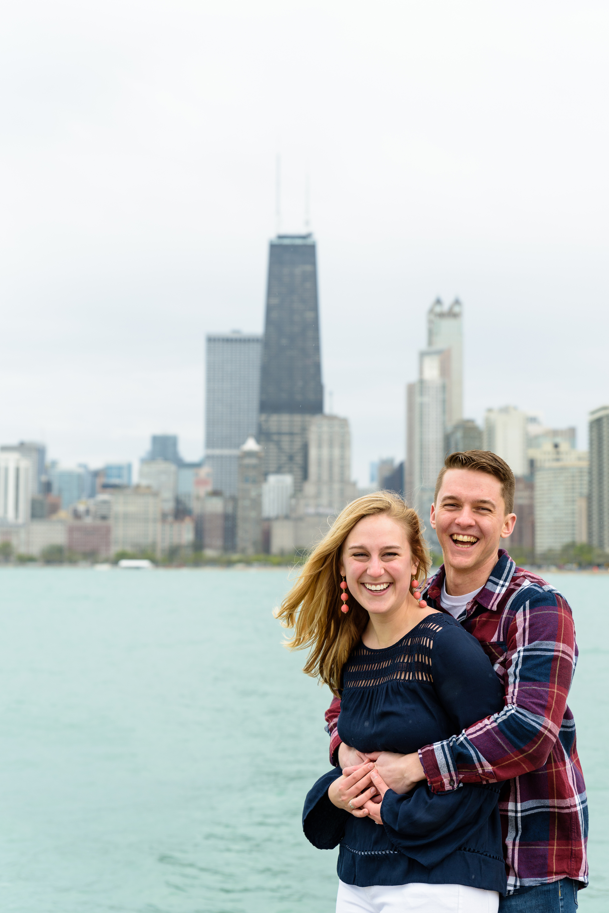 Engagement session at North Ave Beach Pier with the Chicago skyline