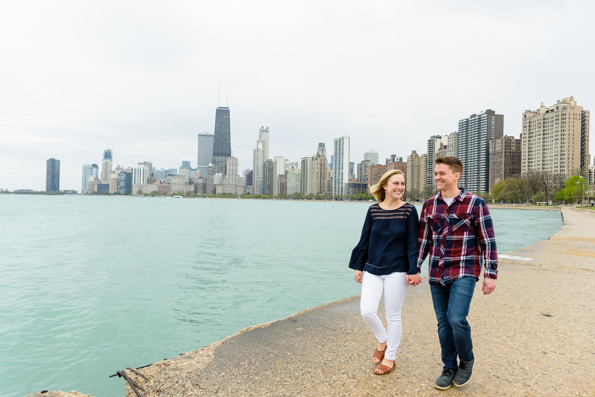 Engagement session at North Ave Beach Pier with the Chicago skyline