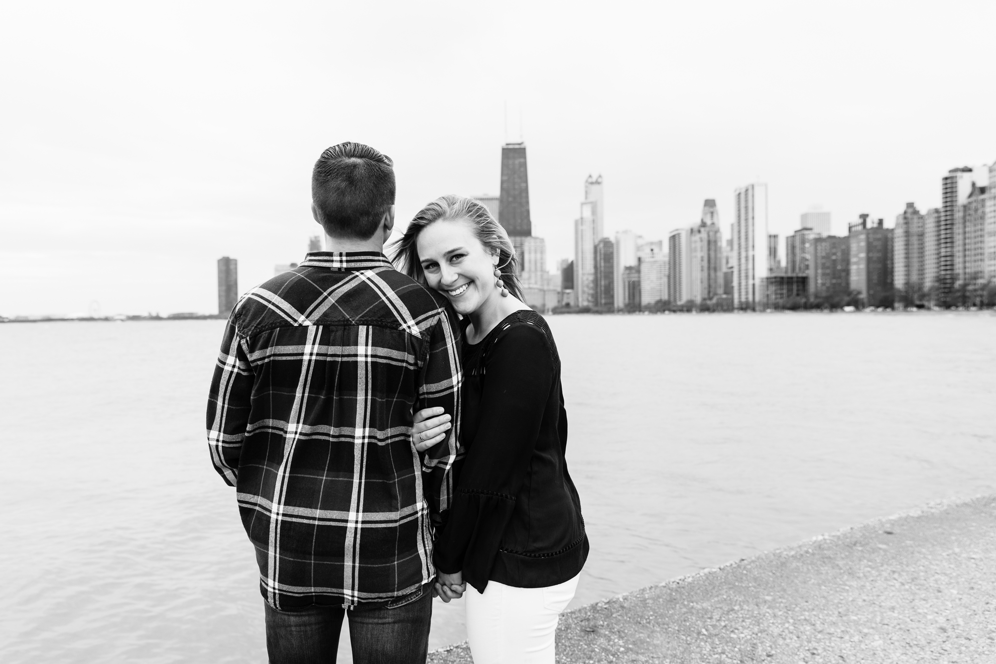 Engagement session at North Ave Beach Pier with the Chicago skyline