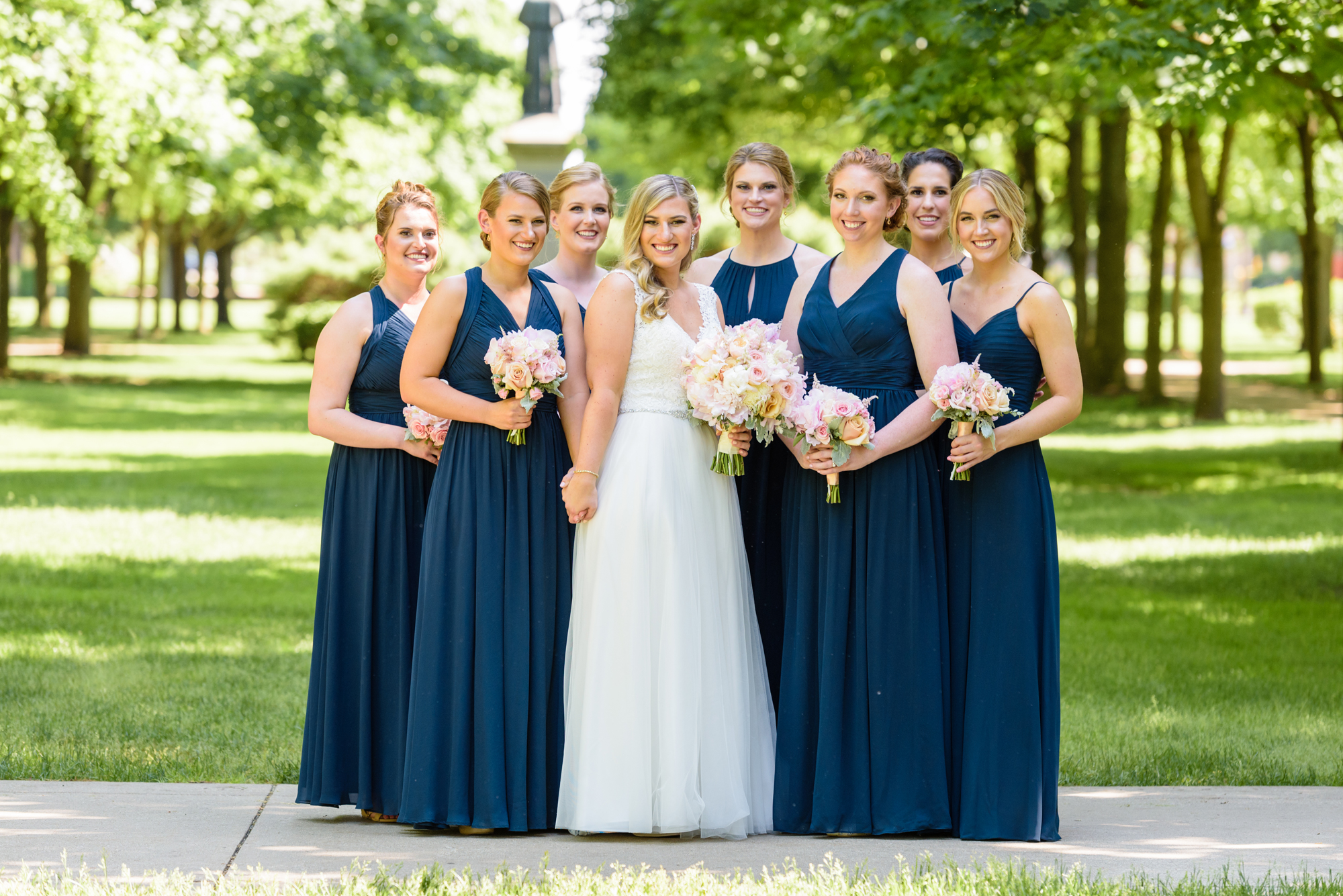 Bridesmaids on God Quad after a wedding ceremony at the Basilica of the Sacred Heart on the campus of Notre Dame