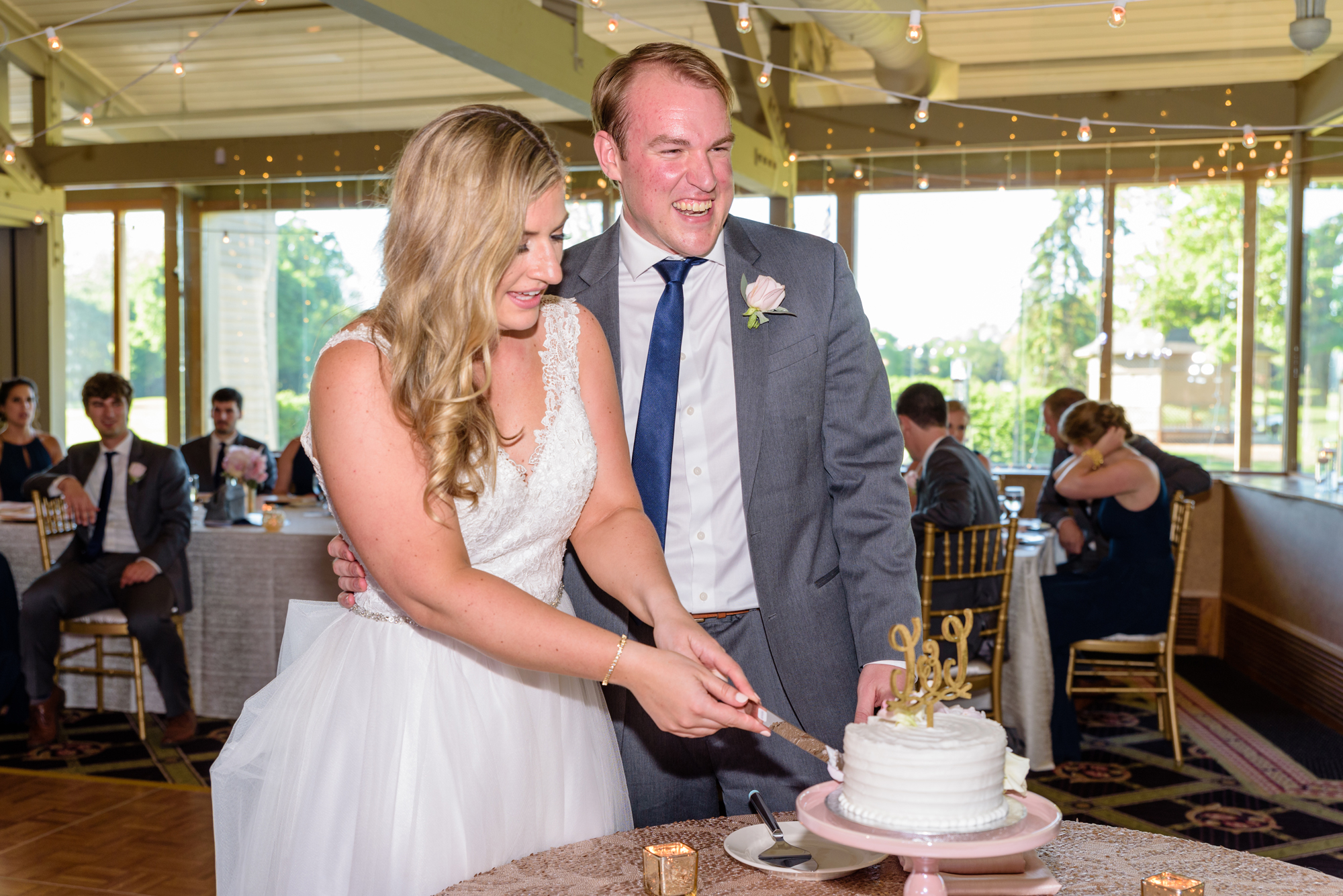 cake cutting at a wedding reception at Morris Park Country Club