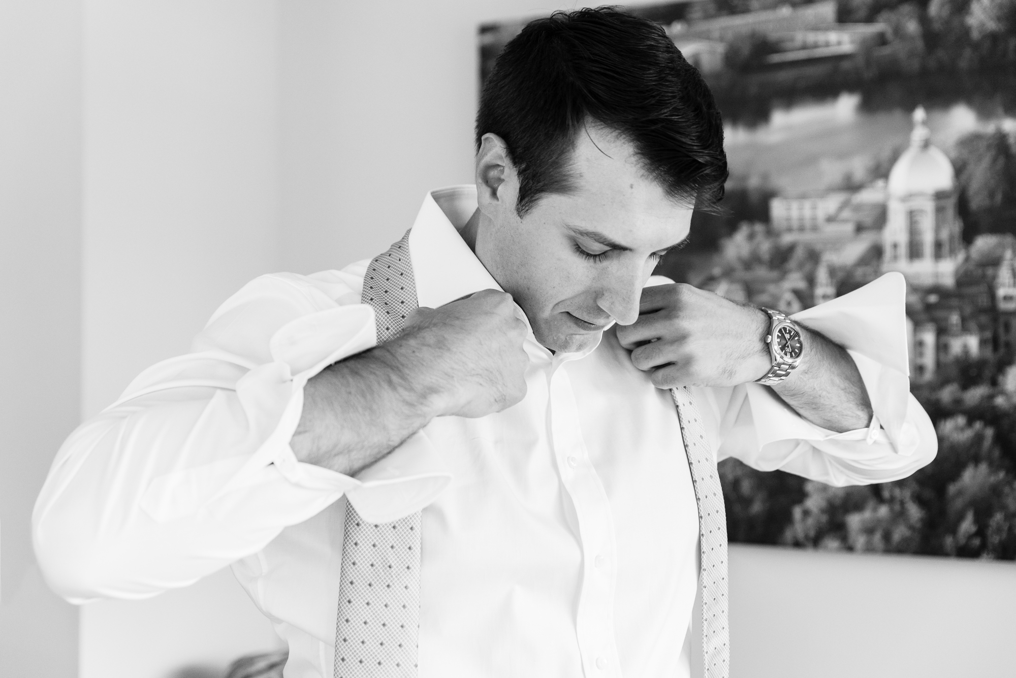 Groom getting ready for his wedding ceremony at the Basilica of the Sacred Heart on the campus of University of Notre Dame