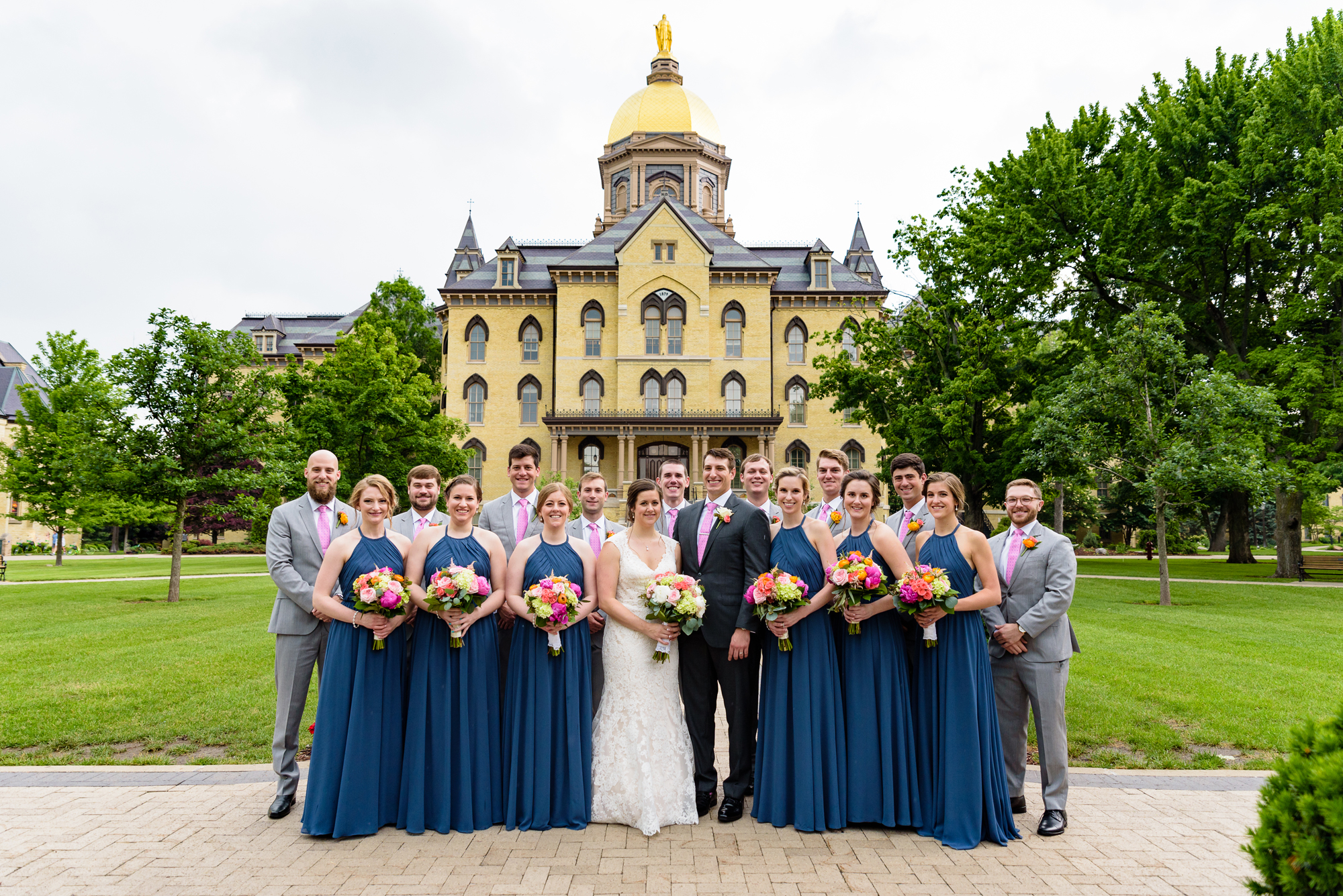 Bridal party in front the Golden Dome on God Quad wedding ceremony at the Basilica of the Sacred Heart on the campus of University of Notre Dame