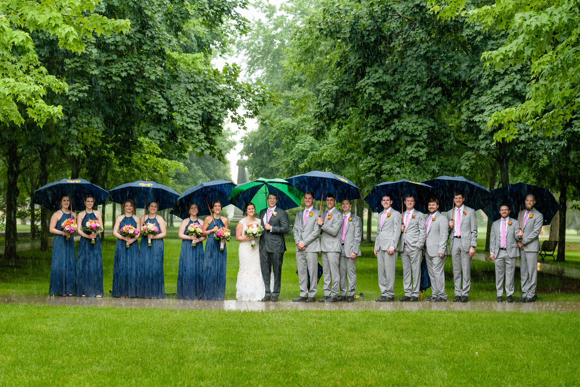 Bridal party in the rain on God Quad wedding ceremony at the Basilica of the Sacred Heart on the campus of University of Notre Dame