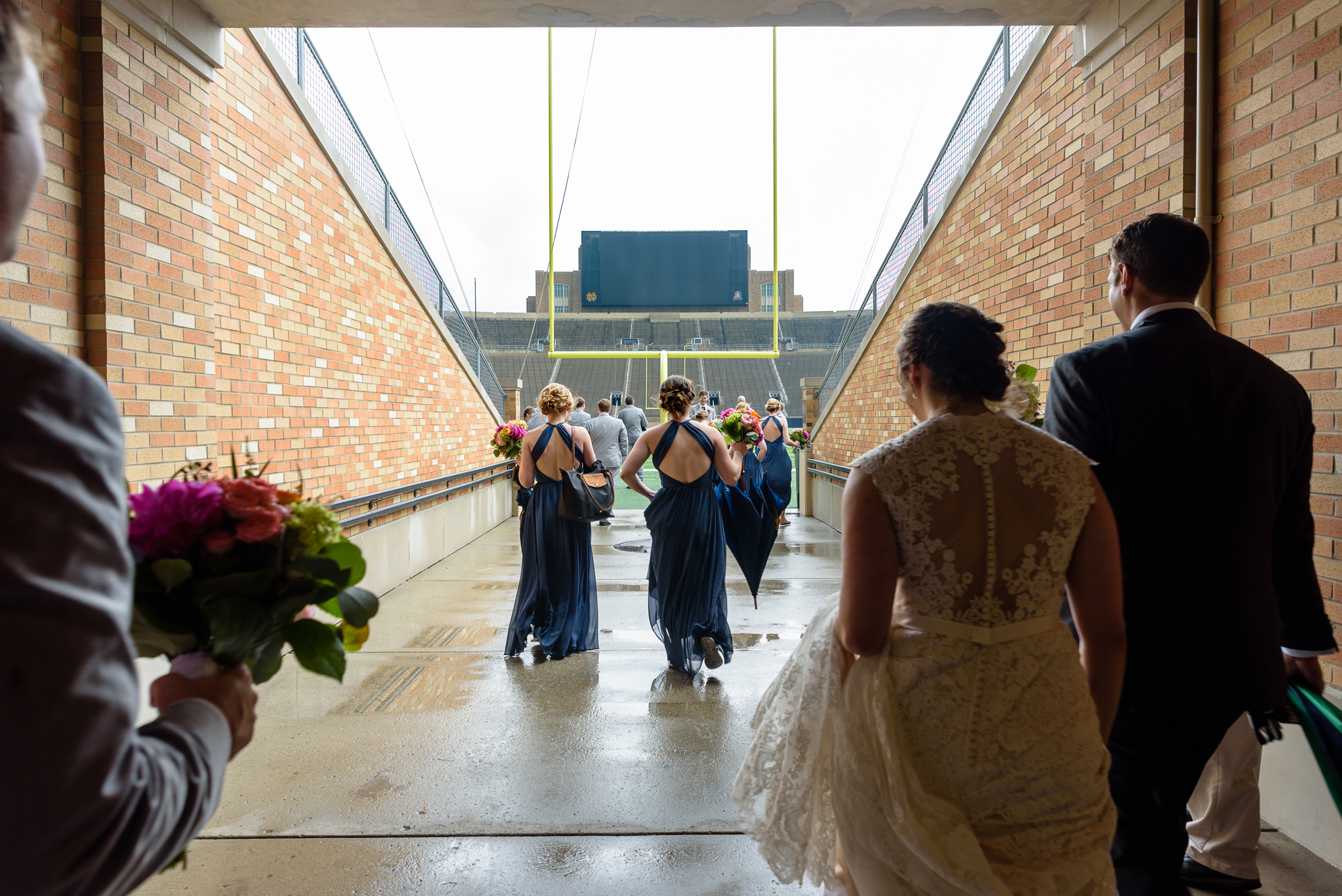 Bridal Party heading into the stadium after their wedding ceremony at the Basilica of the Sacred Heart on the campus of University of Notre Dame