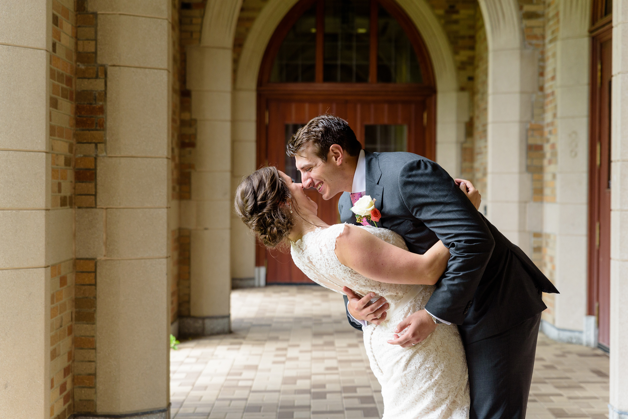 Bride & Groom under the law arches after their wedding ceremony at the Basilica of the Sacred Heart on the campus of University of Notre Dame