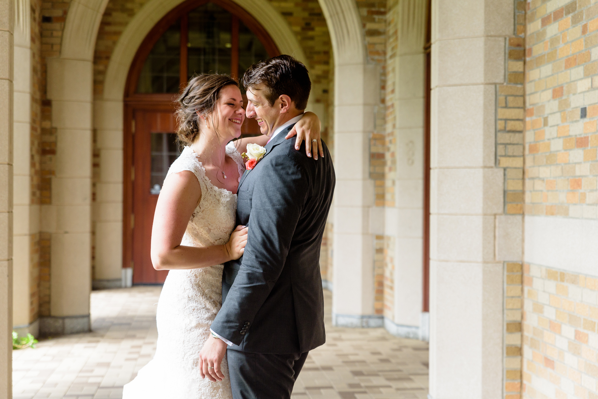 Bride & Groom under the law arches after their wedding ceremony at the Basilica of the Sacred Heart on the campus of University of Notre Dame