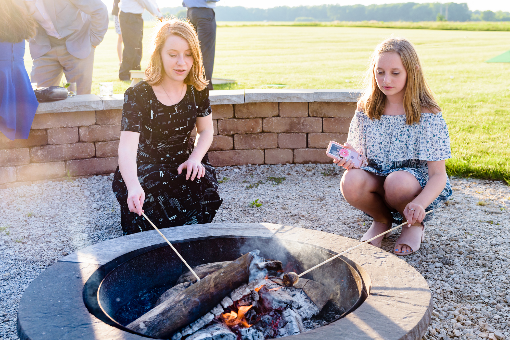 Roasting marshmallows at a Wedding reception at the Homestead 1835