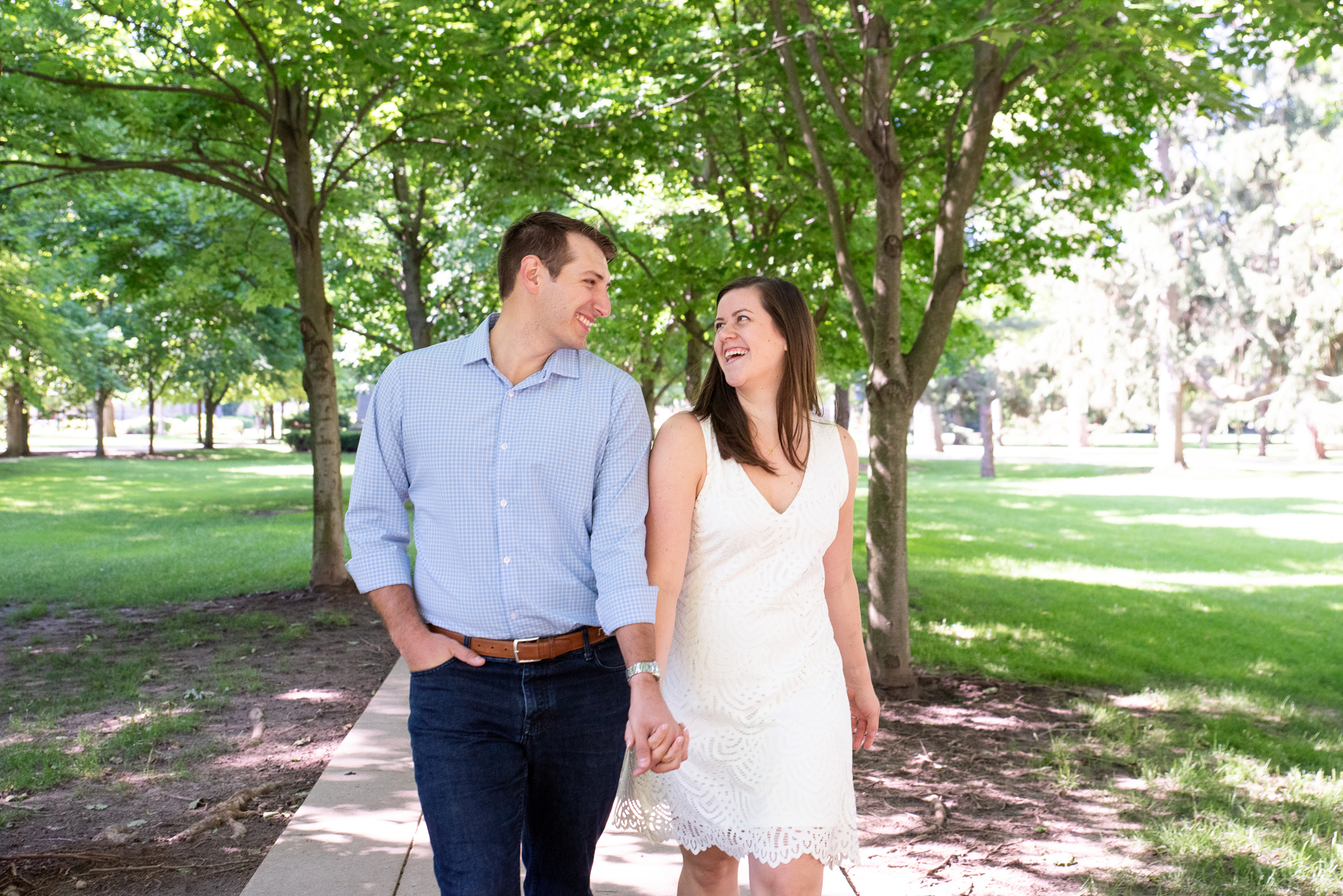 Couple on God Quad under the canopy of trees on the campus of University of Notre Dame