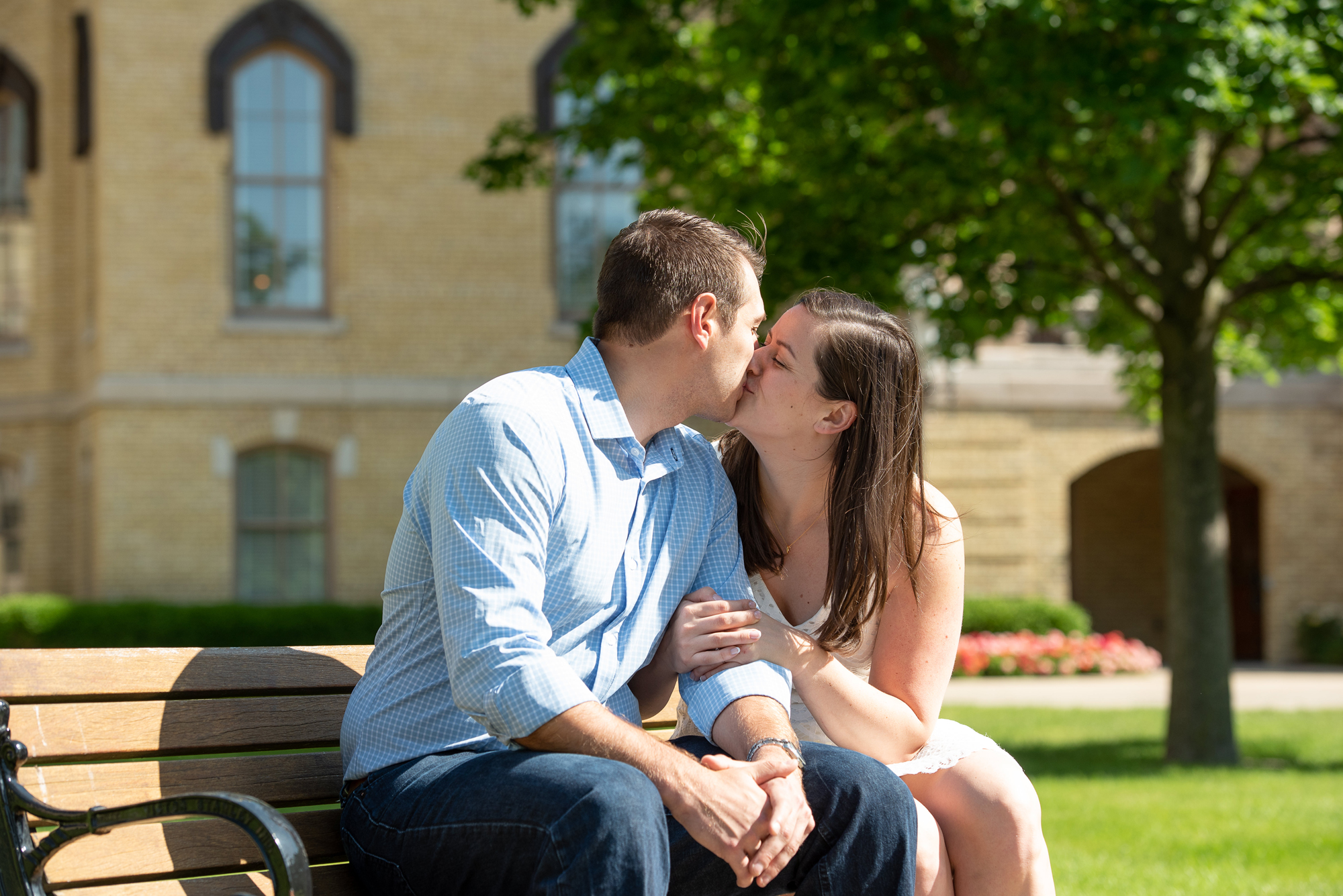 Couple on God Quad in front of the Golden Dome on the campus of University of Notre Dame