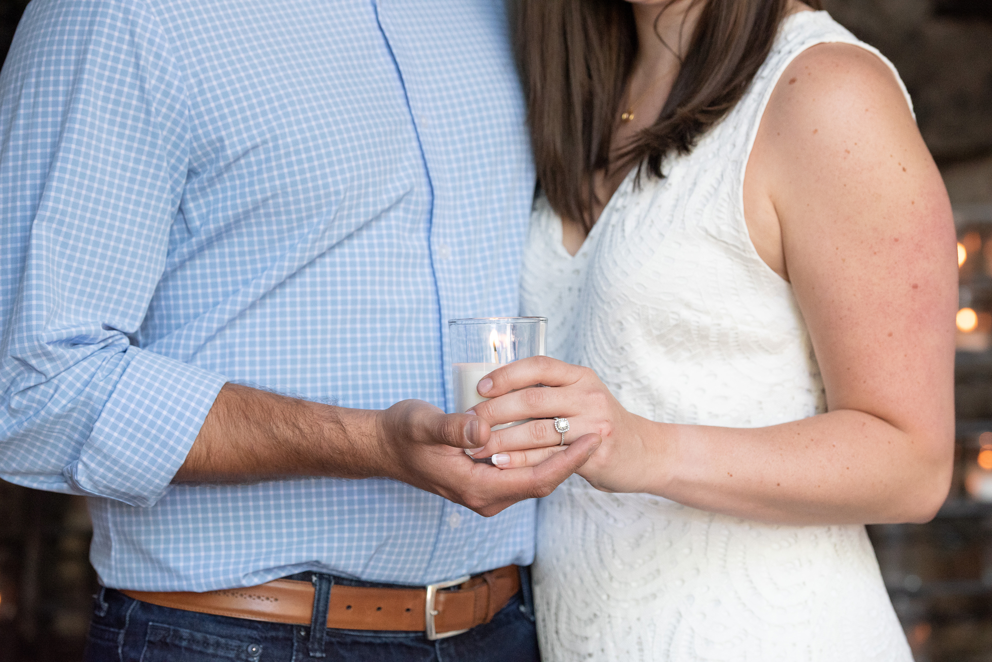 Couple lighting a candle at the Grotto on the campus of University of Notre Dame